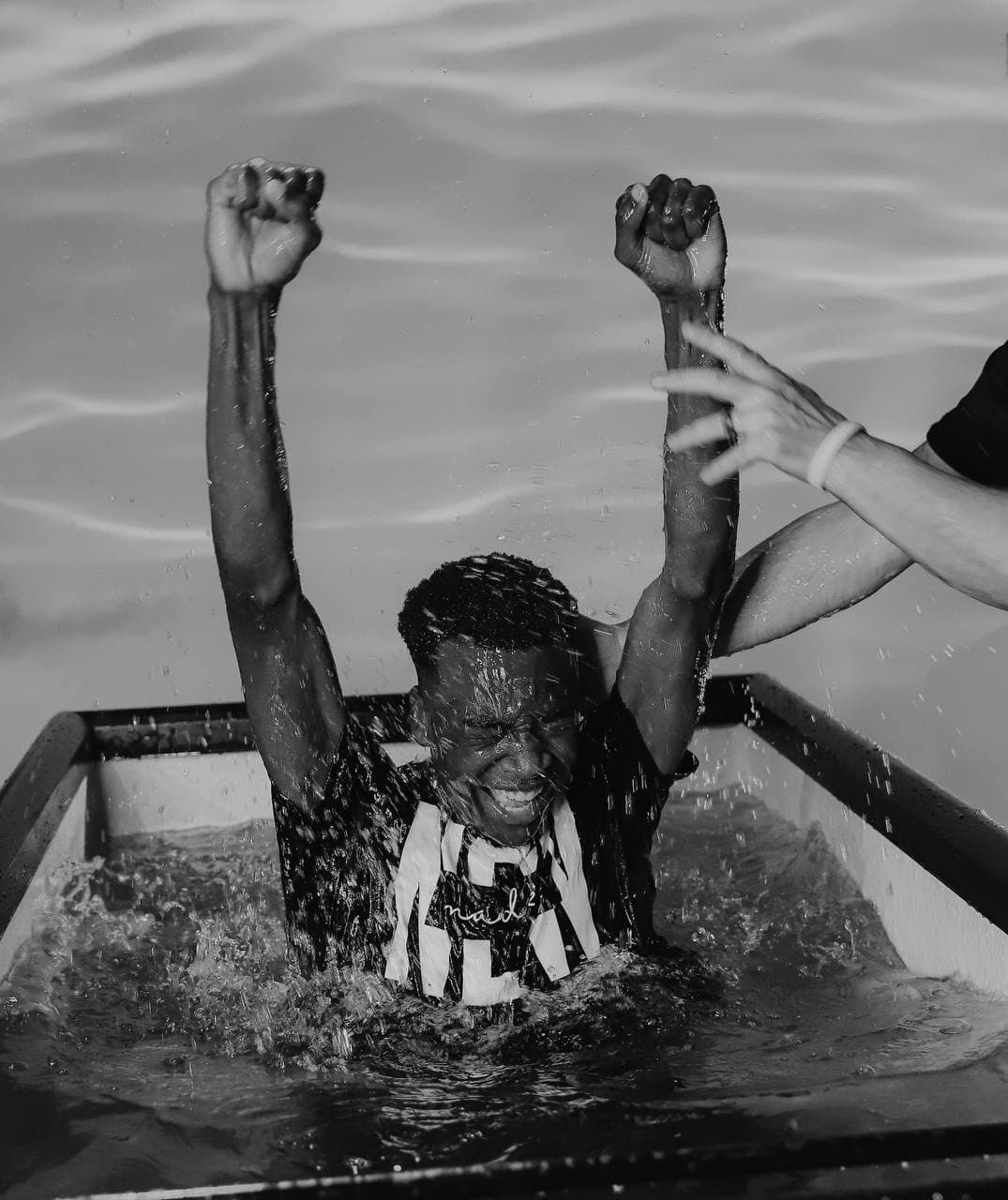 A baptism celebration at Royalhouse Chapel, shown in black and white